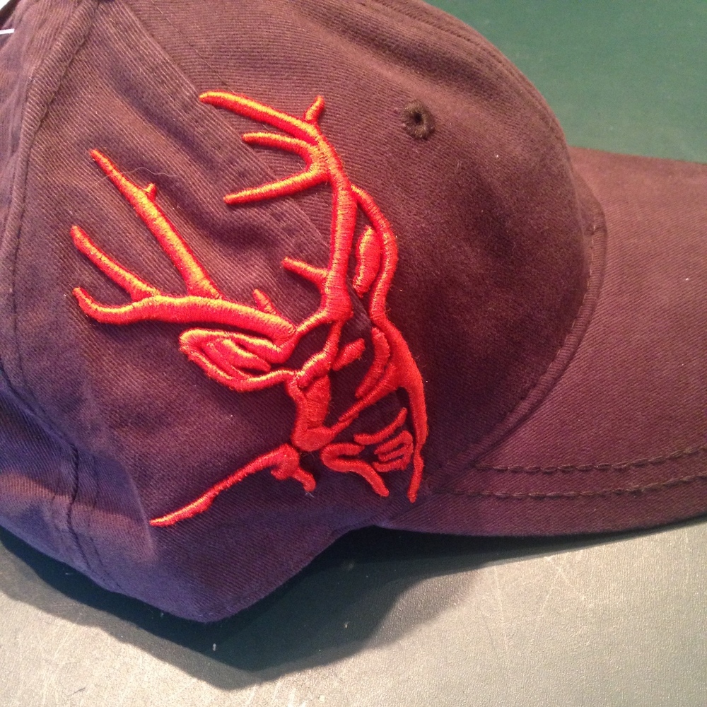 Brown hat with an orange deer